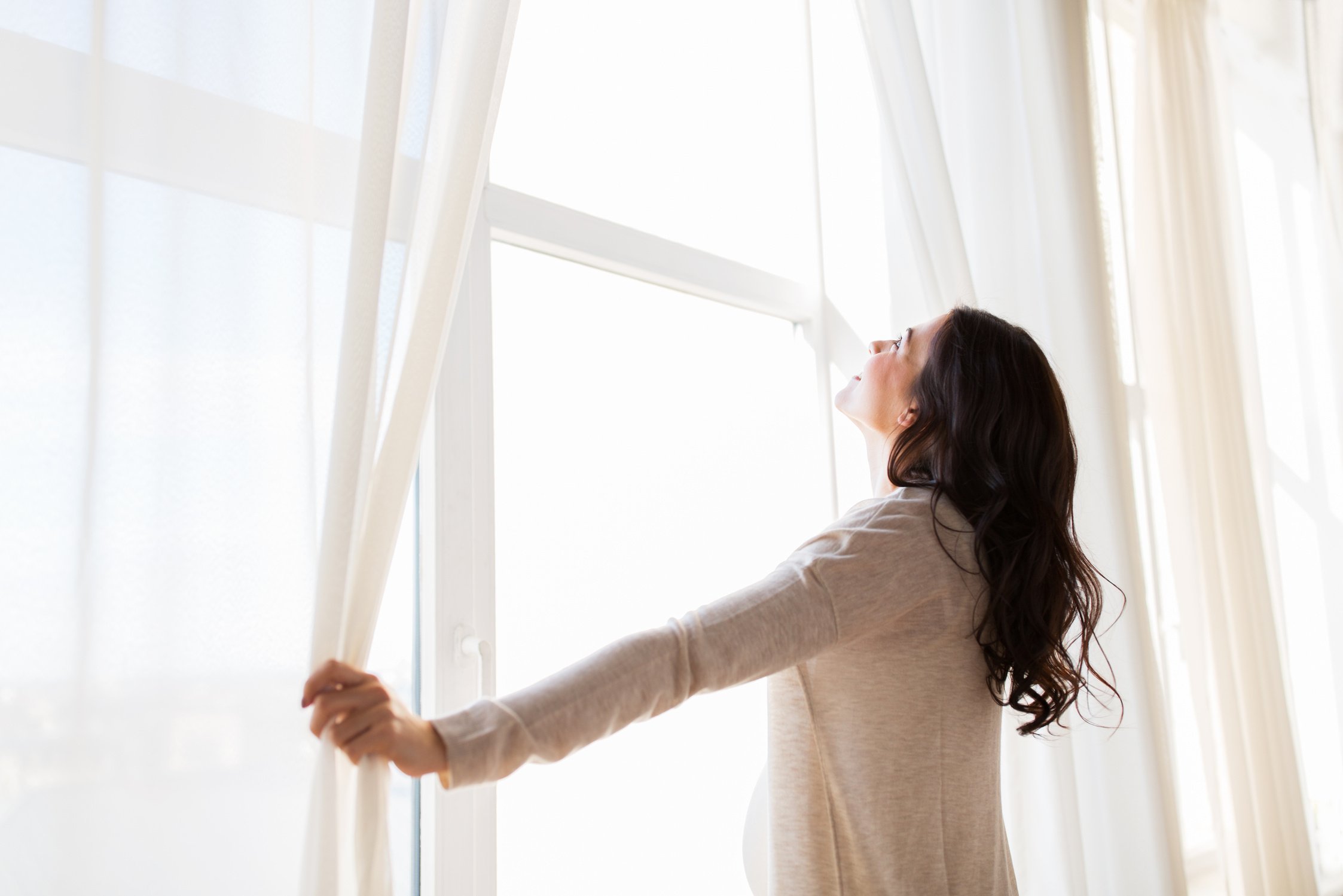 Woman Opening Window